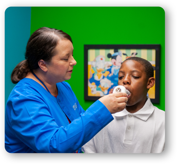 Young man with nurse testing lung capacity